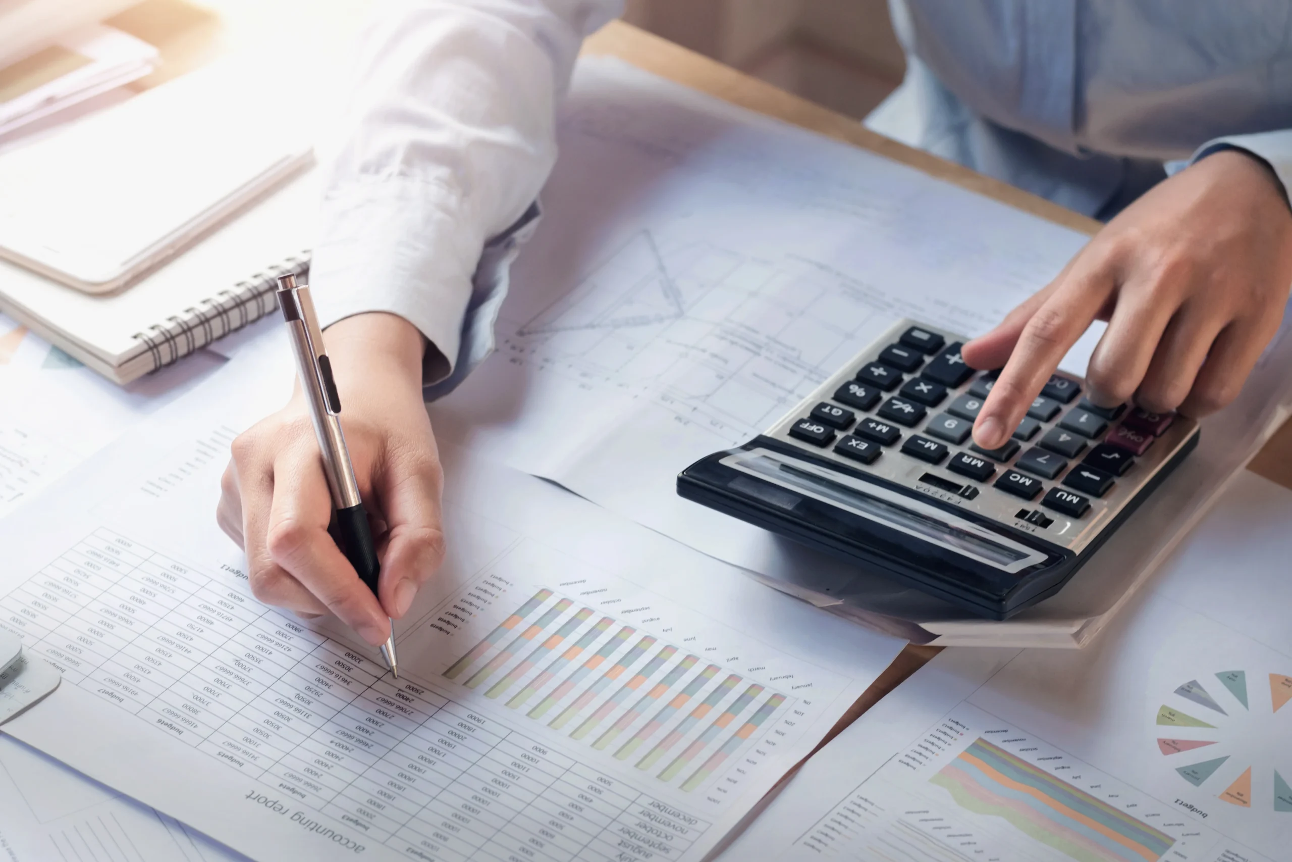 finance-accounting-concept-business-woman-working-desk-using-calculator